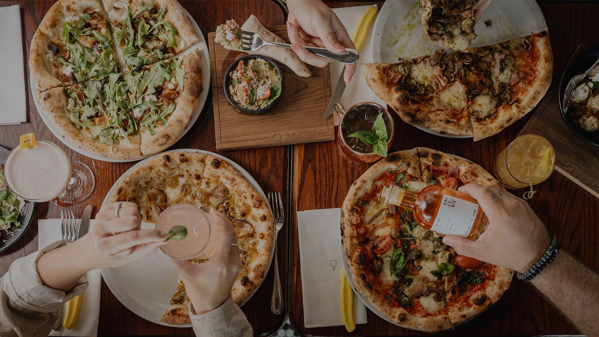 Pizzas, salads, chili oil, and cocktails